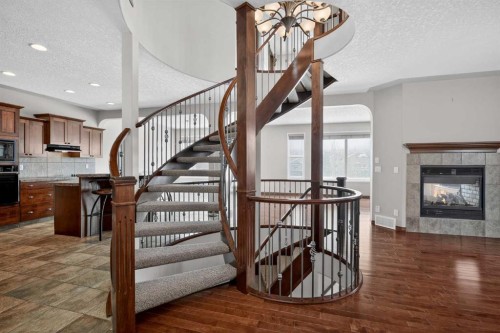 70 Panatella Circle Nw, Calgary, AB - Indoor Photo Showing Other Room With Fireplace