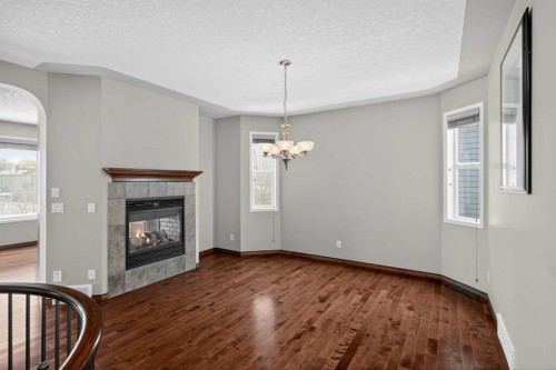 70 Panatella Circle Nw, Calgary, AB - Indoor Photo Showing Other Room With Fireplace