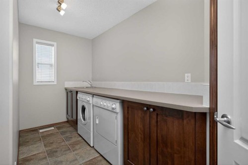 70 Panatella Circle Nw, Calgary, AB - Indoor Photo Showing Laundry Room