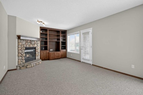 70 Panatella Circle Nw, Calgary, AB - Indoor With Fireplace