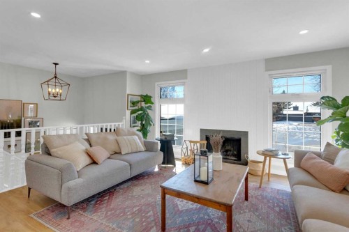 40 Deermont Road Se, Calgary, AB - Indoor Photo Showing Living Room With Fireplace