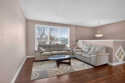 32 Fallingworth Court Ne, Calgary, AB - Indoor Photo Showing Living Room
