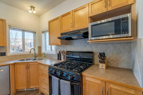 322 Rockyspring Circle Nw, Calgary, AB - Indoor Photo Showing Kitchen With Double Sink