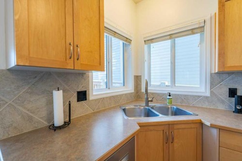 322 Rockyspring Circle Nw, Calgary, AB - Indoor Photo Showing Kitchen With Double Sink