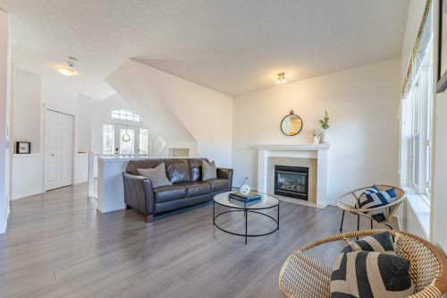 322 Rockyspring Circle Nw, Calgary, AB - Indoor Photo Showing Living Room With Fireplace