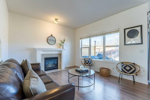 322 Rockyspring Circle Nw, Calgary, AB - Indoor Photo Showing Living Room With Fireplace