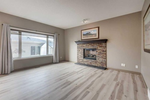 427 Copperfield Boulevard Se, Calgary, AB - Indoor Photo Showing Living Room With Fireplace