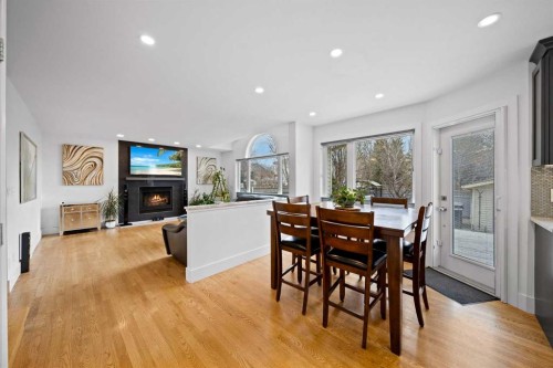 90 Riverview Circle Se, Calgary, AB - Indoor Photo Showing Dining Room With Fireplace