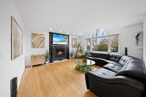 90 Riverview Circle Se, Calgary, AB - Indoor Photo Showing Living Room With Fireplace