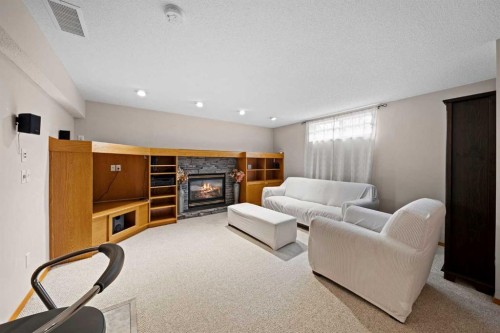 90 Riverview Circle Se, Calgary, AB - Indoor With Fireplace
