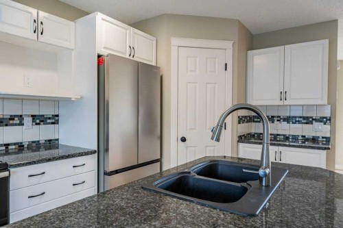 11 Saddlemont Close Ne, Calgary, AB - Indoor Photo Showing Kitchen With Double Sink