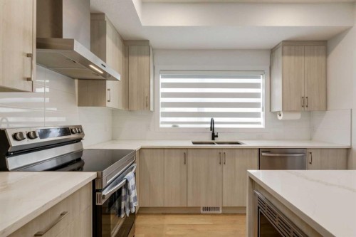 94-903 Mahogany Boulevard Se, Calgary, AB - Indoor Photo Showing Kitchen With Stainless Steel Kitchen With Double Sink