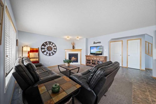 190 Brightonstone Bay Se, Calgary, AB - Indoor Photo Showing Living Room With Fireplace