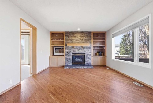 105 Crystalridge Drive, Okotoks, AB - Indoor Photo Showing Living Room With Fireplace