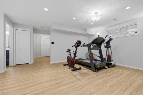 1198 Kingston Crescent Se, Airdrie, AB - Indoor Photo Showing Gym Room
