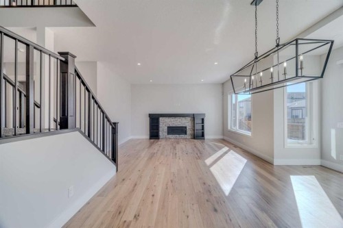 111 Aspen Summit Boulevard Sw, Calgary, AB - Indoor With Fireplace