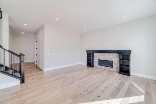 111 Aspen Summit Boulevard Sw, Calgary, AB - Indoor Photo Showing Other Room With Fireplace