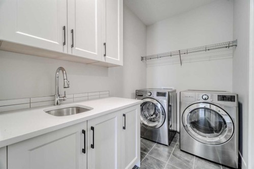 111 Aspen Summit Boulevard Sw, Calgary, AB - Indoor Photo Showing Laundry Room
