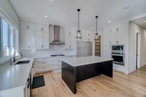 111 Aspen Summit Boulevard Sw, Calgary, AB - Indoor Photo Showing Kitchen With Double Sink With Upgraded Kitchen