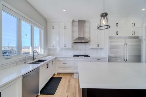 111 Aspen Summit Boulevard Sw, Calgary, AB - Indoor Photo Showing Kitchen With Double Sink With Upgraded Kitchen