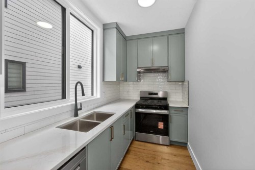 380 Watercrest Place, Chestermere, AB - Indoor Photo Showing Kitchen With Double Sink