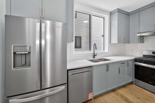 380 Watercrest Place, Chestermere, AB - Indoor Photo Showing Kitchen With Double Sink With Upgraded Kitchen