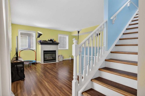 34 Simcoe Place Sw, Calgary, AB - Indoor Photo Showing Other Room With Fireplace
