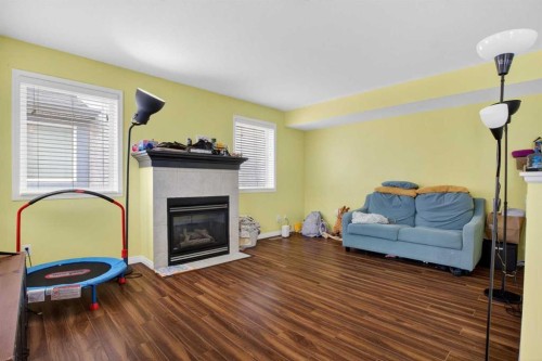34 Simcoe Place Sw, Calgary, AB - Indoor Photo Showing Living Room With Fireplace