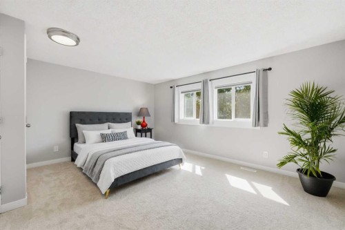 6 Mckernan Place Se, Calgary, AB - Indoor Photo Showing Bedroom