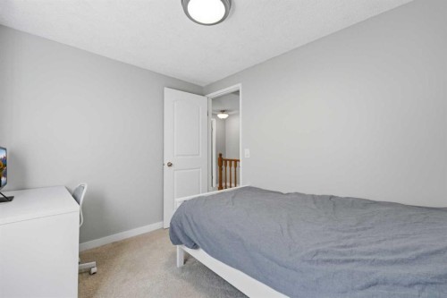 6 Mckernan Place Se, Calgary, AB - Indoor Photo Showing Bedroom