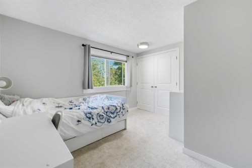 6 Mckernan Place Se, Calgary, AB - Indoor Photo Showing Bedroom