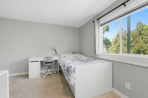 6 Mckernan Place Se, Calgary, AB - Indoor Photo Showing Bedroom