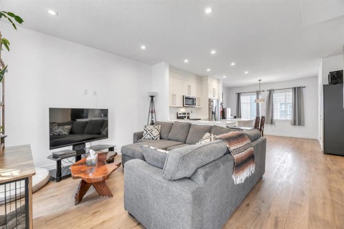 310-669 Savanna Boulevard Ne, Calgary, AB - Indoor Photo Showing Living Room