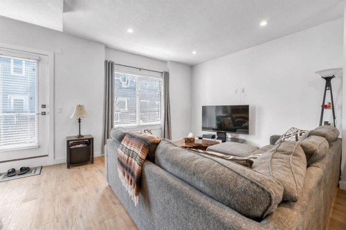 310-669 Savanna Boulevard Ne, Calgary, AB - Indoor Photo Showing Living Room