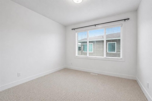 310-669 Savanna Boulevard Ne, Calgary, AB - Indoor Photo Showing Other Room