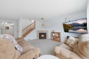 62 New Brighton Circle Se, Calgary, AB  - Indoor Photo Showing Living Room With Fireplace 