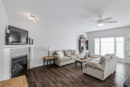 103 Bridle Estates Mews Sw, Calgary, AB - Indoor Photo Showing Living Room With Fireplace