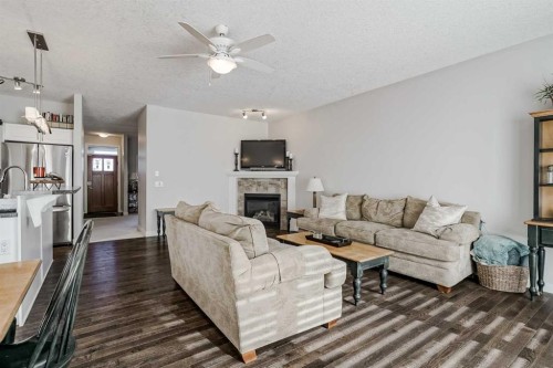 103 Bridle Estates Mews Sw, Calgary, AB - Indoor Photo Showing Living Room With Fireplace