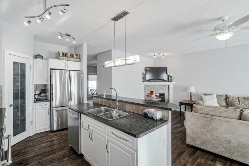 103 Bridle Estates Mews Sw, Calgary, AB - Indoor Photo Showing Kitchen With Stainless Steel Kitchen With Double Sink With Upgraded Kitchen