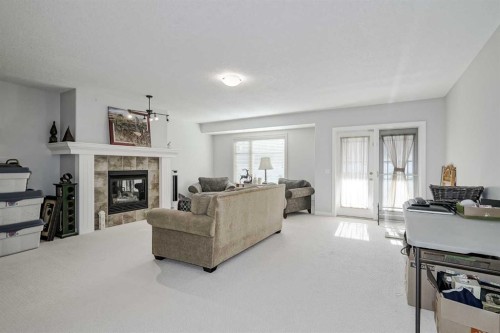 103 Bridle Estates Mews Sw, Calgary, AB - Indoor Photo Showing Living Room With Fireplace