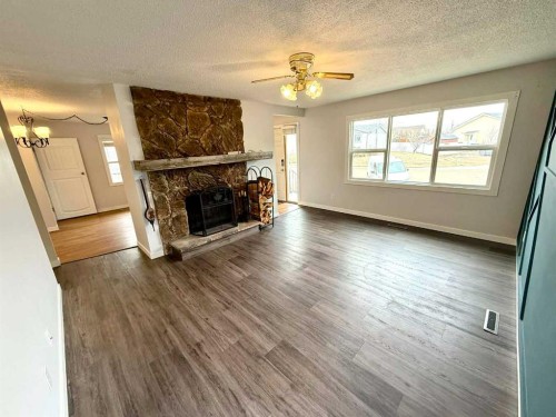 716 Bankview Drive, Drumheller, AB - Indoor Photo Showing Living Room With Fireplace