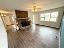 716 Bankview Drive, Drumheller, AB  - Indoor Photo Showing Living Room With Fireplace 