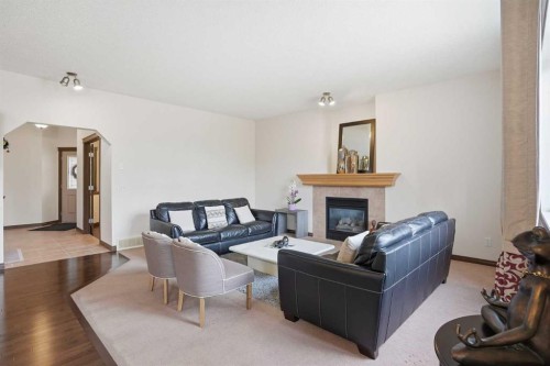6 Springborough Green Sw, Calgary, AB - Indoor Photo Showing Living Room With Fireplace