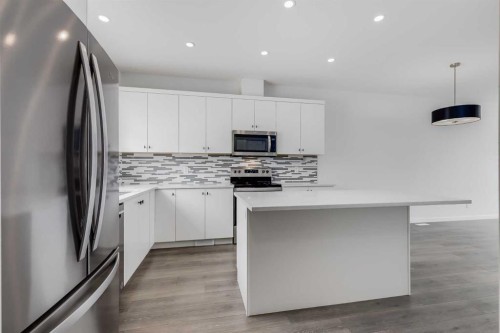 111 Marmot Way Nw, Calgary, AB - Indoor Photo Showing Kitchen With Stainless Steel Kitchen With Upgraded Kitchen