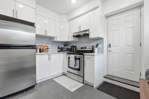 45 Copperpond Avenue Se, Calgary, AB - Indoor Photo Showing Kitchen With Stainless Steel Kitchen
