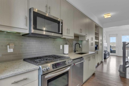 424 Quarry Way Se, Calgary, AB - Indoor Photo Showing Kitchen With Stainless Steel Kitchen With Upgraded Kitchen