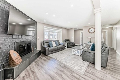 132 Whiteview Close Ne, Calgary, AB - Indoor Photo Showing Living Room With Fireplace