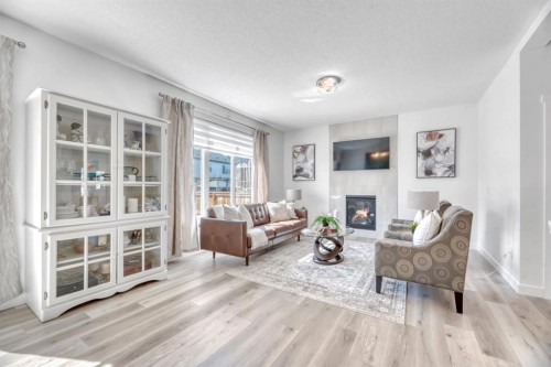 485 Legacy Boulevard Se, Calgary, AB - Indoor Photo Showing Living Room With Fireplace