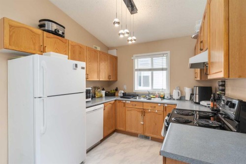 135 Covewood Close Ne, Calgary, AB - Indoor Photo Showing Kitchen With Double Sink