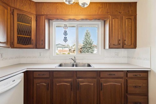 2627 126 Avenue Sw, Calgary, AB - Indoor Photo Showing Kitchen With Double Sink